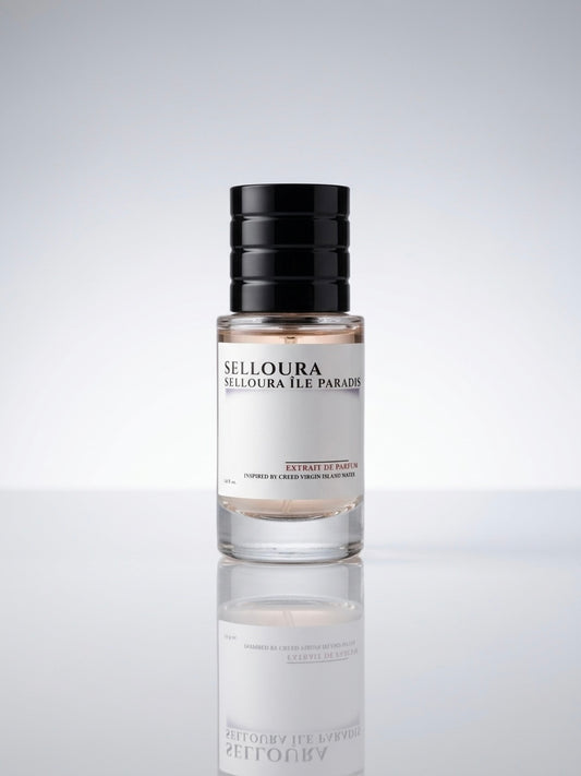 A bottle of Selloura Ilè Paradis perfume with a black cap and a white label, centered on a reflective light gray surface against a light gray background.